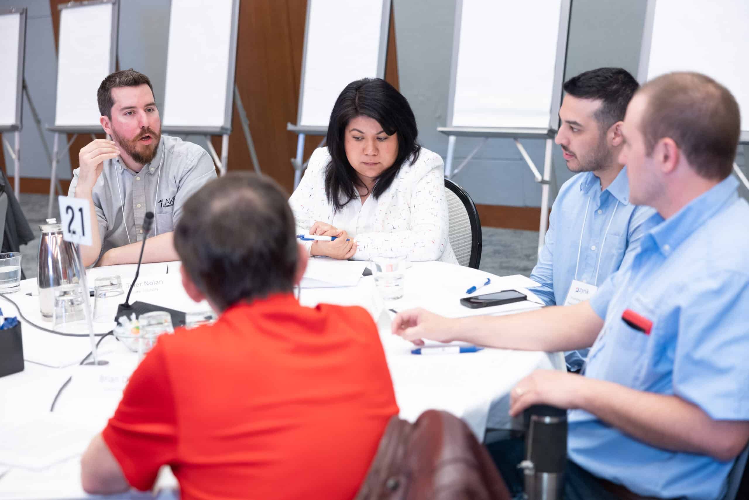 Zynik Learning Seminar Table of Zynik Associates Discussing Case Study